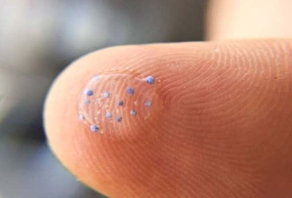 Microbeads on fingertip