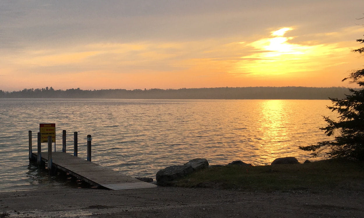 Lake with boat launch at sunset